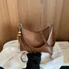 Bolsa Feminina de Axila 2026 Nova Outono Retro Moda Versátil Exquisite Commute Bolsa de Ombro Único Bolsa Saco Transversal