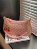 Bolso vintage floral para la axila con estampado retro, bolso nuevo con forma de luna creciente, 2026 nuevo bolso de hombro cruzado elegante de primavera