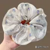 Estilo perezoso 2026 nuevo coletero de oso con pompón y diseño floral, accesorio para el cabello retro y de alta gama para mujeres