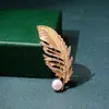 Versión coreana de broche de perla de diamante de alta calidad, moda, hebilla de mariposa anti-luz para bufanda, pasador fino de alta calidad, venta al por mayor de ropa