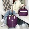 Maleta con Ruedas, Bolsa de Viaje, Maleta Ligera, Rueda Universal, Bolsa de Equipaje de Gran Capacidad, Bolsa de Mano para Abordar Regalo para Hombres y Mujeres Logo