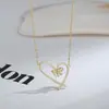 Corrente de clavícula elegante banhada a ouro real com zircônia microincrustada design de nicho feminino colar de laço colar de amor requintado