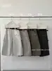 T-PLATFORM Guangzhou Trece Fábricas Otoño Nuevo Diseño de Nicho Ropa de Trabajo Pantalones Casuales Acortados con Correas 26007