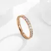Anillo de moda de personalidad de Europa y Estados Unidos semicírculo micro incrustación CNC diez diamantes oro rosa anillo de acero de titanio anillo de niña anillo de cola