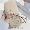 Montura Ovalada Marrón Moderna Ultraligera Moda Lente Transparente Montura de Gafas Unisex 00350