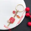 Saludos de Año Nuevo 2025 Palabras Aceite Rojo Goteando Ping An Feliz Caqui Ruyi Rico Llavero Bolso Joyería