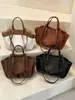 Bolso tote elegante de alta capacidad para mujer, nuevo modelo de verano 2026, bolso de hombro de color liso, bolso de mano moderno y chic