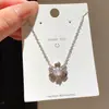 Set de aretes y collar de flor de zirconia cúbica ultra brillante estilo francés, cadena para clavícula dulce y fresca estilo coreano, joyería ligera de lujo con un toque de alta gama