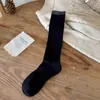 Tacto Súper Suave 2025 Otoño e Invierno Nuevos Calcetines de Lana Cálida de Color Sólido para Mujer Tipo JK Holgados de Tubo Largo Venta al por Mayor