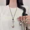 Nueva colección otoño/invierno: Collar colgante lágrima de piedra ojo de tigre color café, un accesorio de cadena larga delicado y lujoso para suéteres