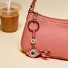 Colgante de Serie Ojo de Diablo Transfronterizo Europeo y Americano Colgante de Llavero de Joyería de Animales Ojo de Hueso con Goteo de Aceite Accesorios de Aleación para Mujeres