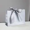 Bolsas de Papel con Moño de Regalo en Stock para Comercio Exterior y Compras Transfronterizas, Personalizables con Impresión de Logo, Envío Gratis