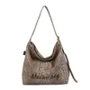Bolsa de Lona de Gran Capacidad Estampado de Leopardo para Mujer 2026 Nuevo Estilo Coreano Ins Bolsa para Estudiante Universitario Clase Viaje Diario Bolsa de Cubo Tote