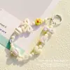 Nueva Cadena para Teléfono Móvil de Abalorios con Forma de Estrella y Lazo Accesorios Colgantes Estilo Miu Creativo Llavero Colgante para Bolsa de Auriculares Venta al por Mayor