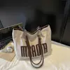 Bolso de Hombro Único de Gran Capacidad con Textura de Moda para Mujer 2025 Nuevo de Moda Estudiante Clase Viaje Diario Bolso Tote con Letras