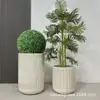 Jarrón de piso a rayas de moda decoración de sala de exposiciones de hotel maceta de óxido de magnesio para el hogar arreglo floral decoración de edificio de oficinas planta verde