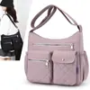 Bolsa transversal de nylon de grande capacidade, novo estilo para mulheres, bolsa de ombro popular para mulheres de meia-idade, bolsa casual para mães, bolsa de tecido 2026