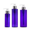 Botellas dispensadoras de cosméticos Xumin en stock 100-200 ml Botellas con bomba de loción 250 ml Botellas de loción azules de hombro plano