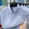 Camisa Oxford 100% Algodão 2026 Nova Moda Camisa Casual Simples e Confortável Cardigã Masculino de Manga Curta