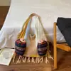 Bolsa de hilo tejida única para mujer, gran capacidad, versátil, adecuada para ir al trabajo, nuevo estilo 2026, linda bolsa de hombro tejida