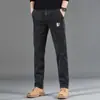 Jeans casuales de alta gama estilo americano de alta calle, ajustados, multibolsillos, para comercio exterior transfronterizo, disponibles en cuatro colores 2026