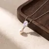 Estilo minimalista popular en Europa y América: Collar de cadena para clavícula de joyería con perla de gota de agua de circón incrustado de cobre, collar de lujo ligero de nicho versátil y elegante