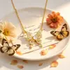 Exquisito y elegante collar de mariposa estilo francés para mujer, lleno de diamantes, estilo de hada, versátil para el uso diario, accesorio de alta gama