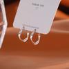 Nuevos pendientes con hebilla de oreja de anillo Mobius retorcido para mujer, pendientes tipo botón, diseño de nicho para mujer, joyería para las orejas, venta al por mayor en vivo