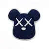 Kaws dibujó44 zapatos de agujero de traje de moda zapatos flor sabiduría estrella pegamento suave DIY estudiante croc accesorios al por mayor