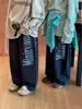 Otoño 2026 Nuevo Estilo Coreano Pantalones de Chándal con Estampado de Letras Grandes para Niños Unisex Casual Versátil Felpa de Algodón