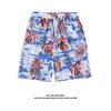 Férias de Verão na Praia em Sanya Calças Floridas Masculinas de Cinco Pontos Casuais Versáteis Shorts Havaianos Shorts Largos de Praia
