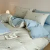 Juego de cuatro piezas estilo Ins de algodón jacquard cepillado de clase A engrosado, funda de edredón de algodón puro, sábana plana, sábana bajera, juego de ropa de cama de tres piezas