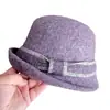 Sombrero de pescador de ala ancha estilo Hepburn para niños, otoño e invierno, sombrero de punto de lana australiana, sombrero de cubo con lazo de color, sombrero de moda versátil