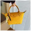Bolsas de Alta Gama para Mujer 2025 Nuevo Estilo Simple y a la Moda Bolso Bandolera Bolso Dumpling Diseño de Nicho Versátil Bolso de Hombro Único Cruzado