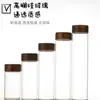 Frasco de almacenamiento sellado de vidrio de borosilicato de 47 mm de diámetro con tapa roscada de madera de acacia para dispensar polvo y gránulos