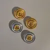 Dazan Venda Quente Em Estoque Atacado de Fábrica Europeu e Americano Titânio Aço Galvanizado Ouro Real 18K Olho de Gato Preto Pedra Natural Brincos Redondos