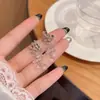 Aretes Florales Frescos y Delicados para Mujer, Suaves y Elegantes, Aretes Tipo Bobina de Mosquitos Sin Perforación, Lujo Ligero con un Toque de Alta Gama, Aretes de Flor de Lirio
