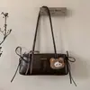 Bolsa Pequena Retro Texturizada de Luxo para Mulheres 2025 Novo Modelo Versátil Bolsa de Ombro para o Dia a Dia Bolsa de Mão Fashion Bolsa Baguette