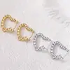 Pendientes de Acero Inoxidable con Forma de Corazón Hueco, Venta Caliente Transfronteriza, Estilo Minimalista de Nicho, Pendientes Simples y Elegantes, Wholesale de Yiwu