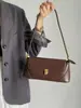 Bolsa de Mão de Nicho Francês Feminina 2025 Nova Moda Retro Bolsa de Ombro Bolsa Bagel Bolsa de Ombro Média Antiga