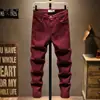 Jeans casuais justos e elásticos para jovens Outono e Inverno 2022 masculinos de luxo leve cor sólida jeans slim atacado e varejo