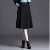 Nueva falda de mujer elegante, sencilla, de color liso, nueva para otoño e invierno 2026, de cintura alta, adelgazante, con dobladillo grande que cubre las caderas, falda de línea A
