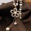 Cadena de suéter larga cruzada espejo para mujer, collar largo de tulipán, accesorios colgantes para ropa de temperamento, fabricantes venden