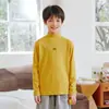 Camiseta Básica de Media Cuello Alto de Terciopelo Alemán de Doble Cara para Niños Otoño e Invierno 2025 Panda Yuanyuan Top de Capa Interior Cálida para Niños