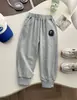 26 Nueva Colección de Otoño: Pantalones casuales holgados estilo coreano para niños y niñas, pantalones rectos versátiles y modernos con puños elásticos