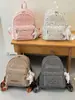 Mochila com estampa de estrelas, grande capacidade, simples e versátil, adequada para estudantes, estilo coreano, com estampas de letras e um visual preppy de faculdade.