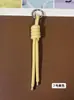 Llavero de cordón de cuero PU transfronterizo, colgante versátil para bolso, accesorios de decoración para botellas de agua y muñecas DIY, llaveros al por mayor