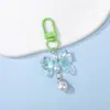 Llavero accesorio con colgante de perla y lazo de lunares color caramelo de resina, charm para bolso de cuentas, venta al por mayor de joyería