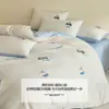 Juego de ropa de cama de cuatro piezas de algodón con bordado 2026 nuevo estampado de dibujos animados funda de edredón de algodón puro juego de ropa de cama de tres piezas para dormitorio cama individual