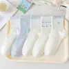 Calcetines azul claro con lazo para mujer, calcetines blancos lechosos de media pantorrilla para primavera y otoño, estilo japonés moderno, versátiles, dulces, calcetines deportivos para estudiantes